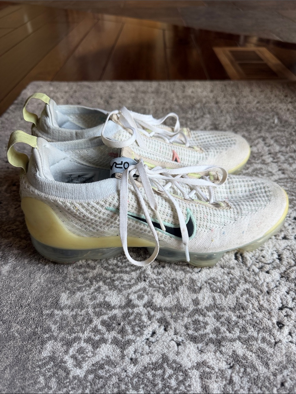 Nike Flyknit VaporMax Sneakers in Off-White with Pale Yellow and Black Accents